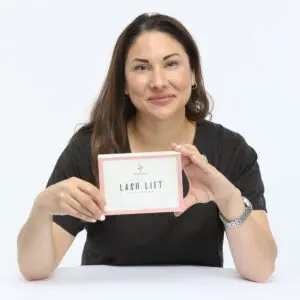 A woman holding up a card with the word " labor life ".