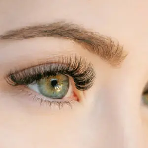 A close up of the eye with long eyelashes